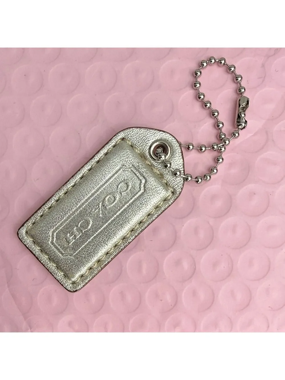 Coach Shimmering Silver Tag Keychain Coach Hangtag Coach bag accessories